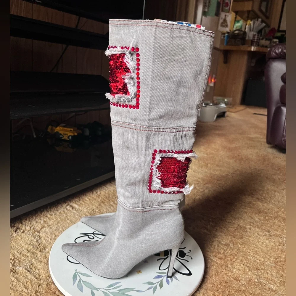 Woman’s multi-color red stone denim pointy toe knee-high boots.